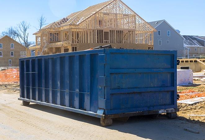 a stack of residential dumpsters, ready for rental